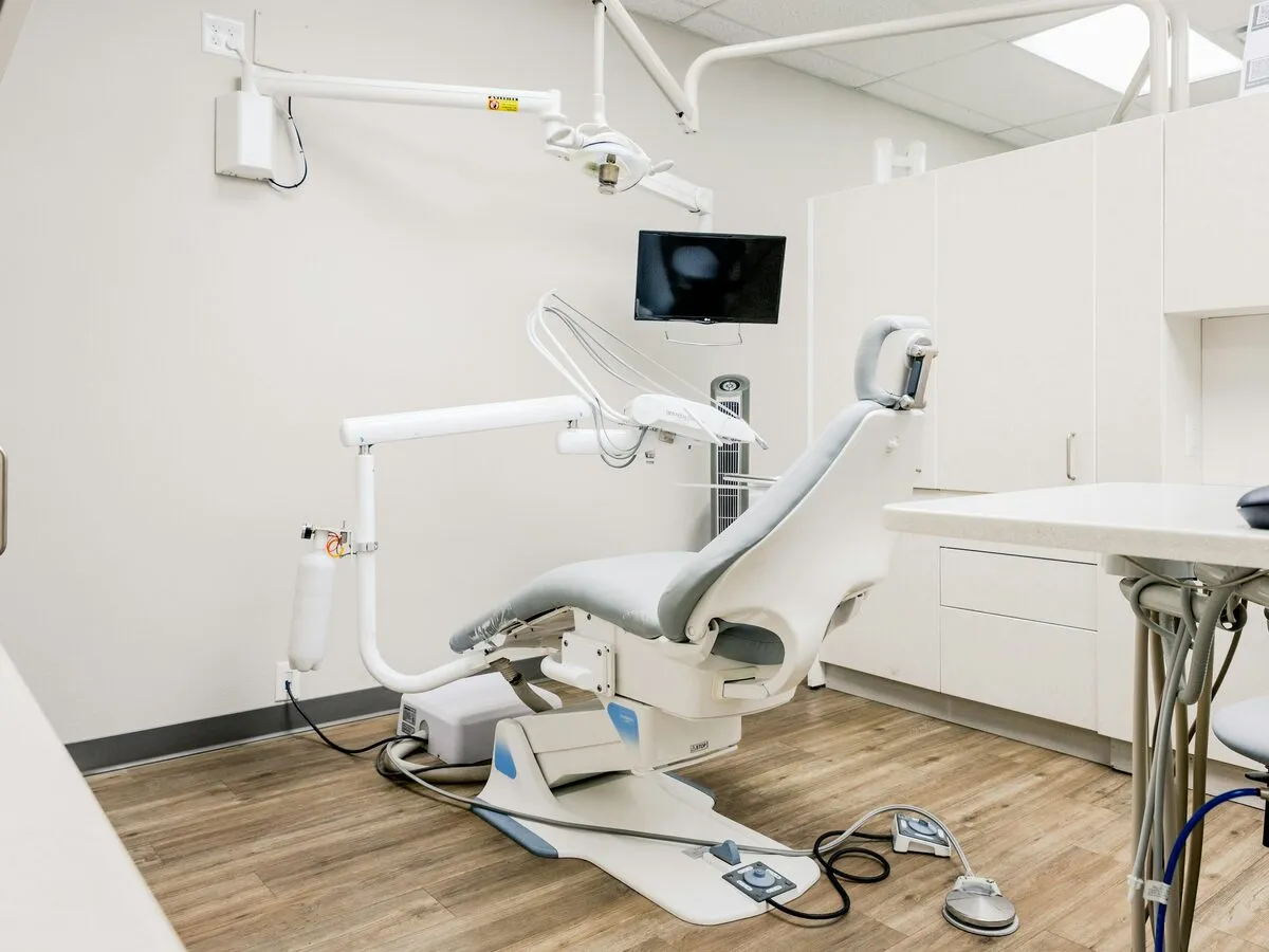 Ground-floor treatment room with a white dental chair
