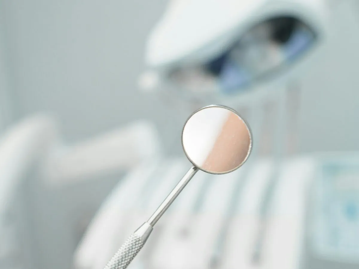 Close-up of a dental mirror in a treatment room
