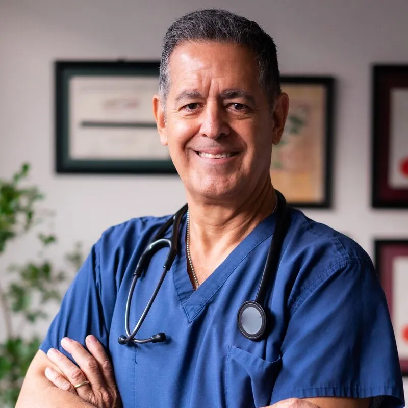 Dr Tom Aldridge, dentist, in blue scrubs